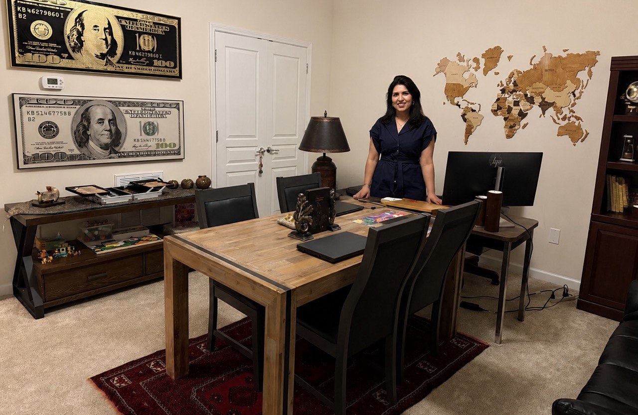 Asma Mohrsab in her consulting office with world map background